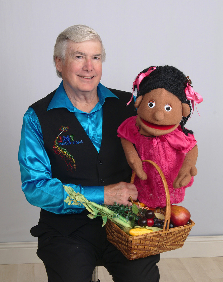 Mr. T, the Jamila puppet, and a basket of vegetables