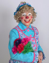 Rainbow the Clown holding flowers