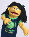 A puppet in a "peas" T-shirt