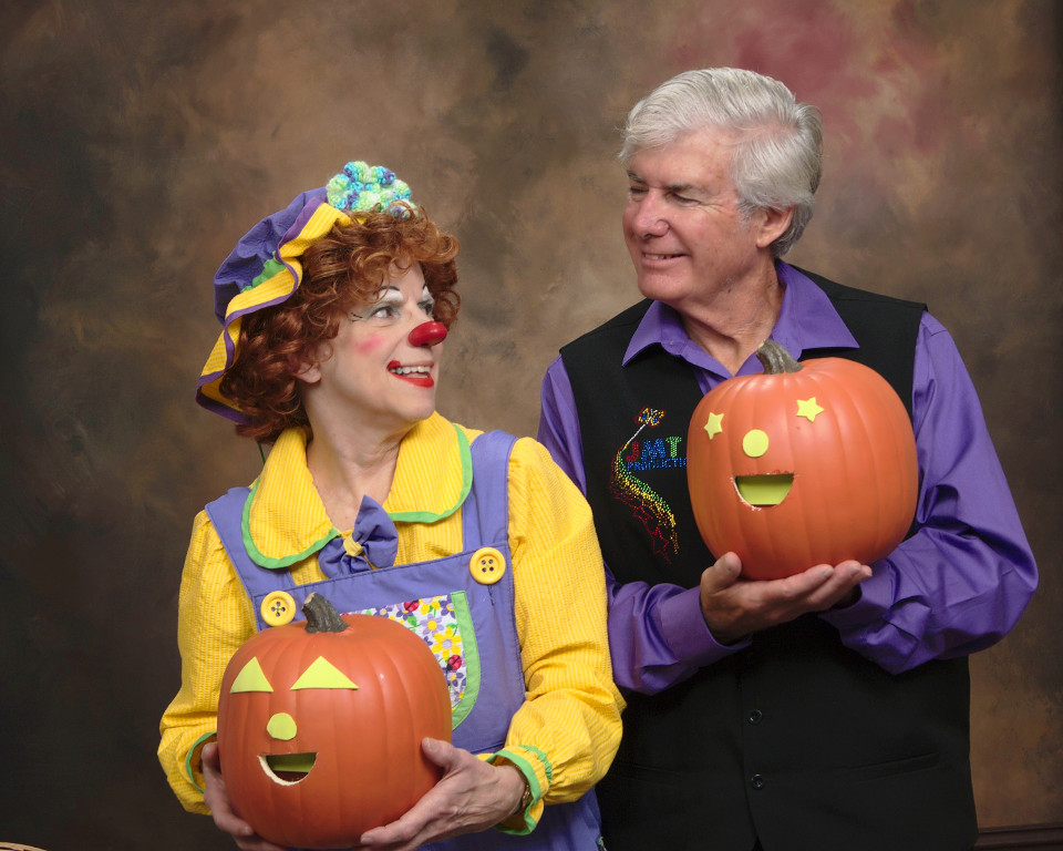 Rainbow and Mr. T show off their jack-o-lanterns