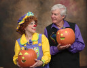 Rainbow and Mr. T show off their jack-o-lanterns