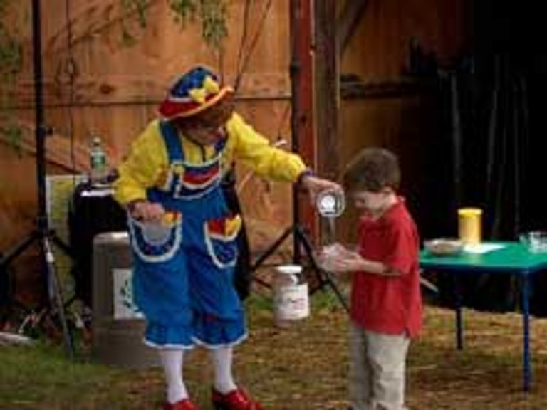 A young boy participates in the show with Rainbow