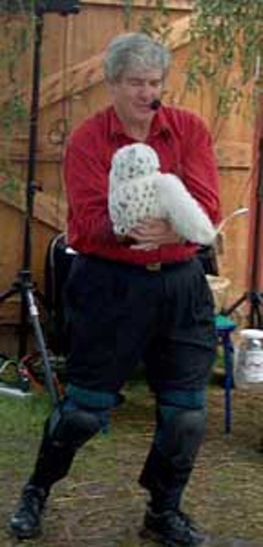 Mr. T holds an owl puppet