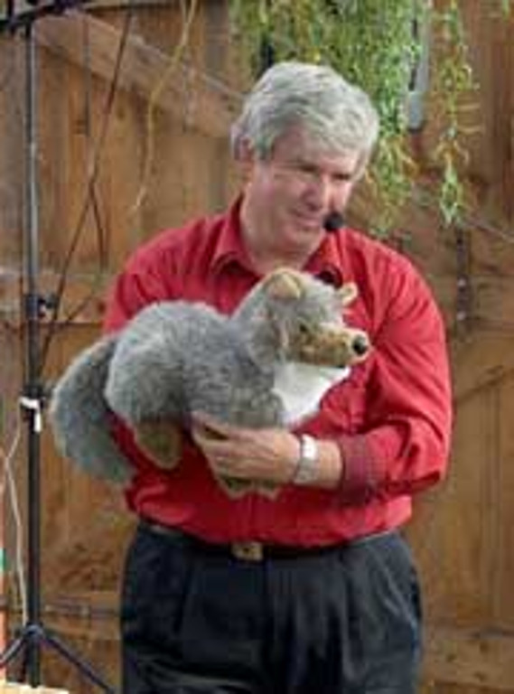 Mr. T holds a wolf puppet