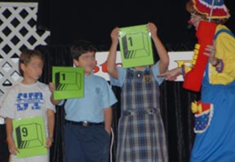 Rainbow, with an oversized phone, and children with 9-1-1 signs